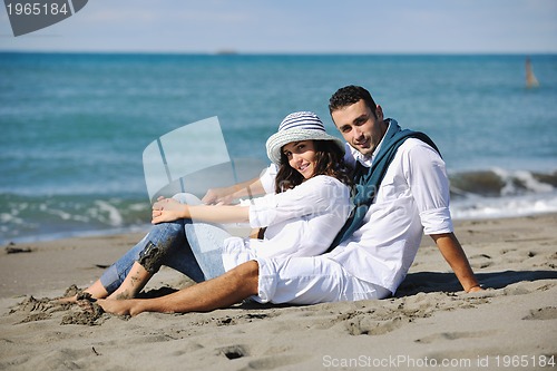 Image of happy young couple have fun at beautiful beach