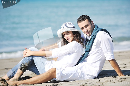 Image of happy young couple have fun at beautiful beach