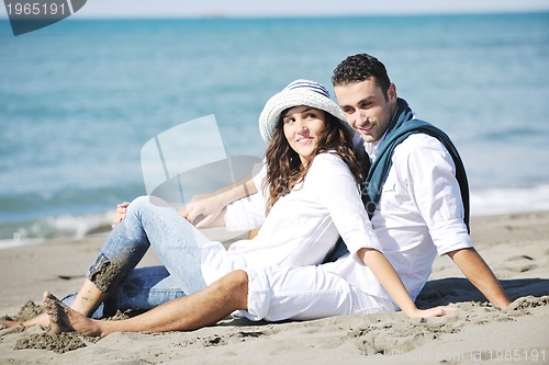 Image of happy young couple have fun at beautiful beach