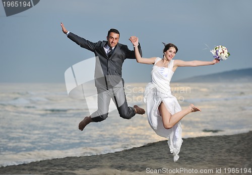 Image of romantic beach wedding at sunset