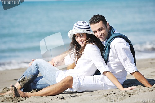 Image of happy young couple have fun at beautiful beach
