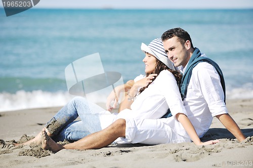Image of happy young couple have fun at beautiful beach