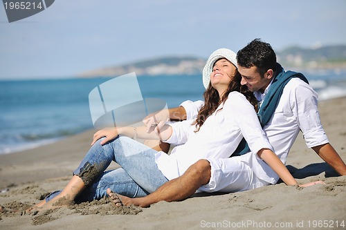 Image of happy young couple have fun at beautiful beach