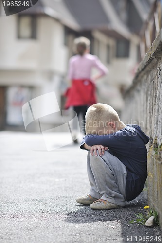 Image of sad lonely boy on street