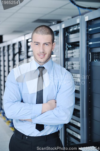 Image of young it engineer in datacenter server room