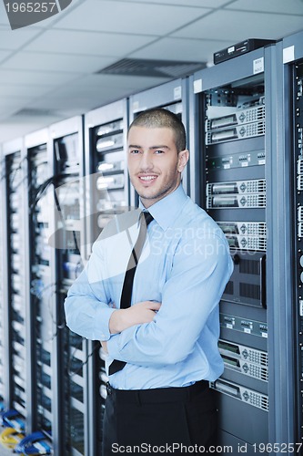 Image of young it engineer in datacenter server room