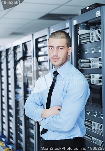 Image of young it engineer in datacenter server room