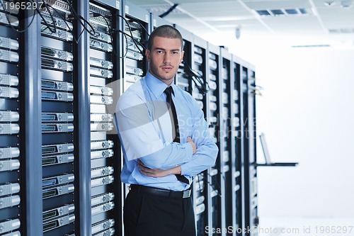 Image of young it engeneer in datacenter server room