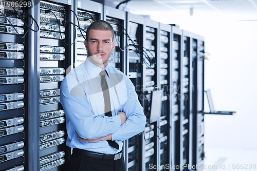 Image of young it engineer in datacenter server room