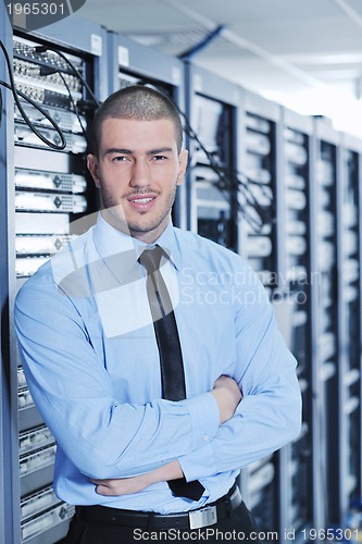 Image of young it engineer in datacenter server room