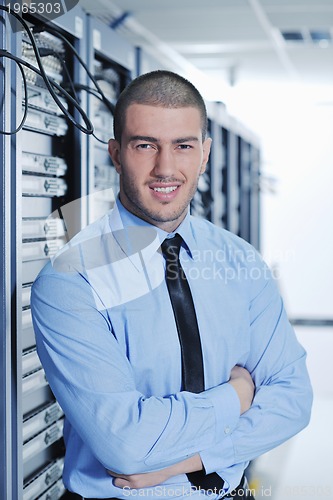 Image of young it engeneer in datacenter server room