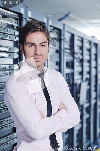 Image of it engineers in network server room