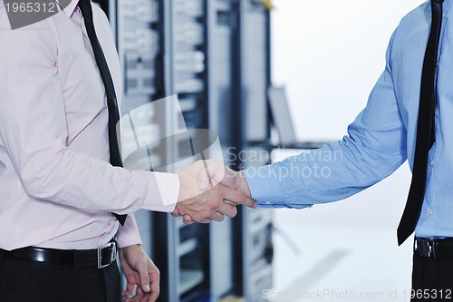 Image of it engineers in network server room