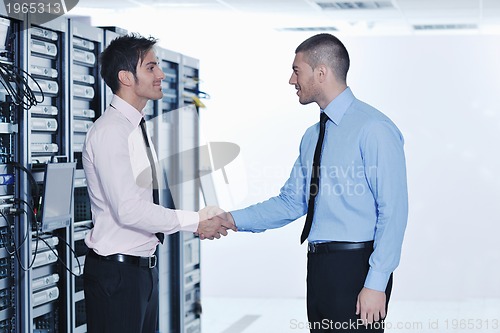 Image of it engineers in network server room