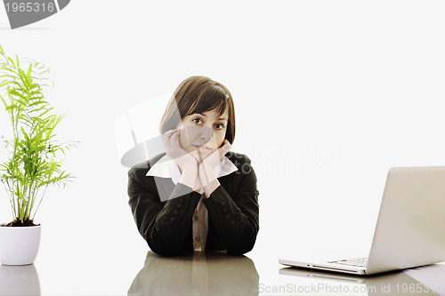 Image of business woman working on laptop