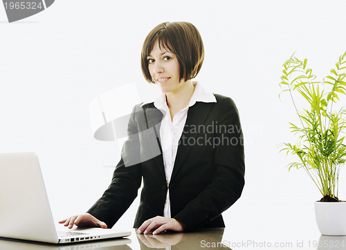 Image of business woman working on laptop