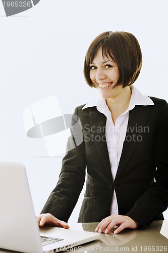 Image of business woman working on laptop