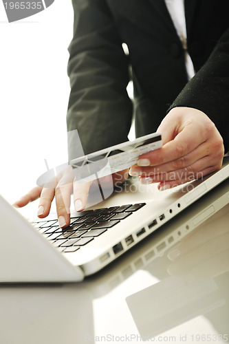 Image of business woman making online money transaction