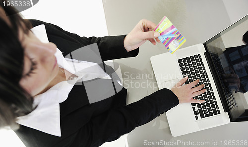 Image of business woman making online money transaction