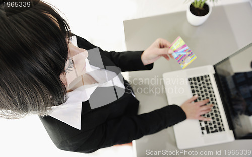 Image of business woman making online money transaction