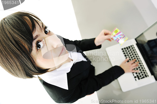 Image of business woman making online money transaction