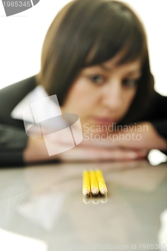 Image of bosiness woman choosing perfect pencil