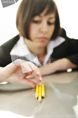 Image of bosiness woman choosing perfect pencil