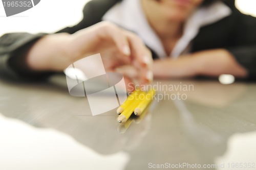 Image of bosiness woman choosing perfect pencil