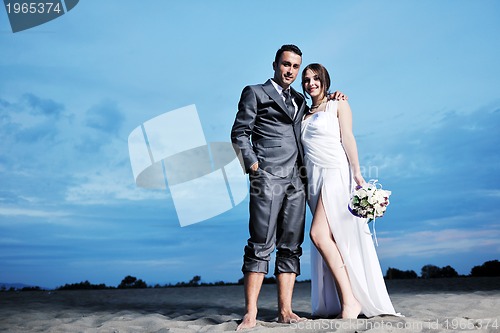 Image of romantic beach wedding at sunset