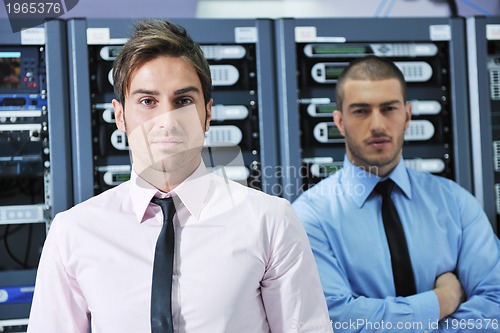 Image of it engineers in network server room