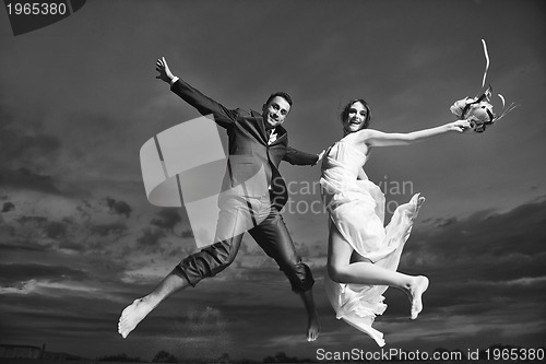 Image of romantic beach wedding at sunset