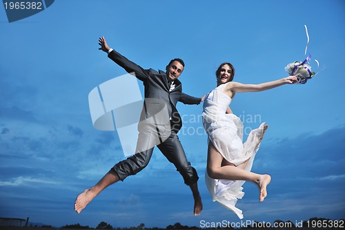 Image of romantic beach wedding at sunset