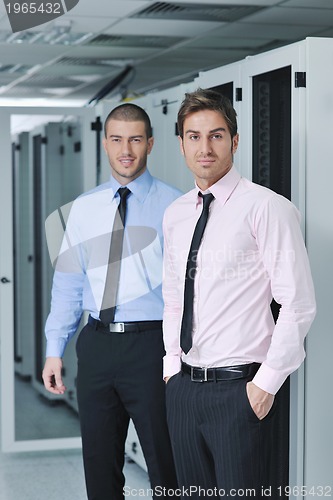 Image of it engineers in network server room