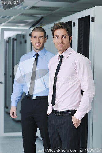 Image of it engineers in network server room