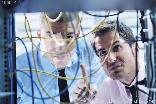 Image of it engineers in network server room