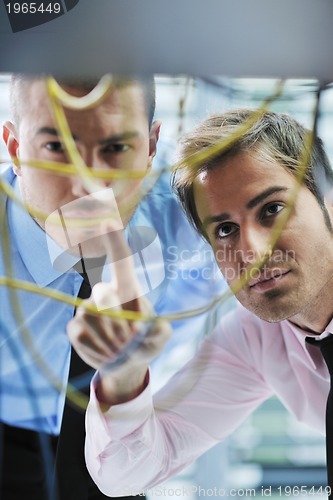 Image of it engineers in network server room