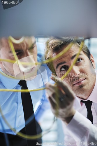 Image of it engineers in network server room