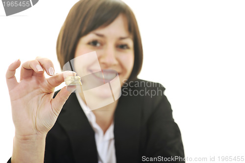 Image of business woman putting coins money in piggy bank