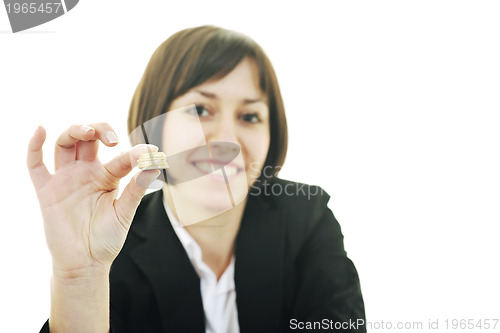 Image of business woman putting coins money in piggy bank