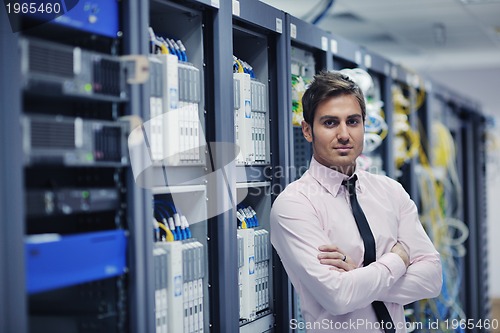 Image of young it engeneer in datacenter server room