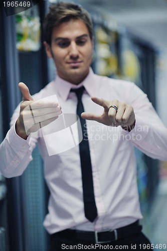 Image of young it engeneer in datacenter server room