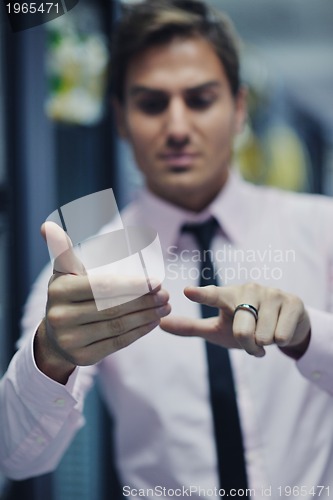 Image of young it engeneer in datacenter server room