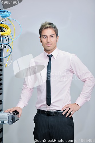 Image of young it engineer in datacenter server room