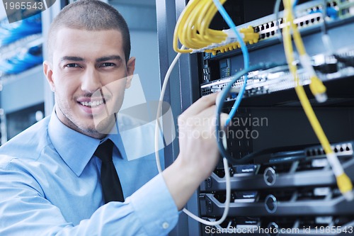 Image of young it engineer in datacenter server room
