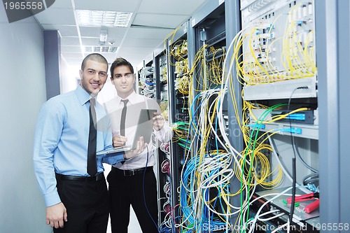 Image of it engineers in network server room