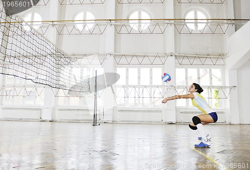 Image of girls playing volleyball indoor game