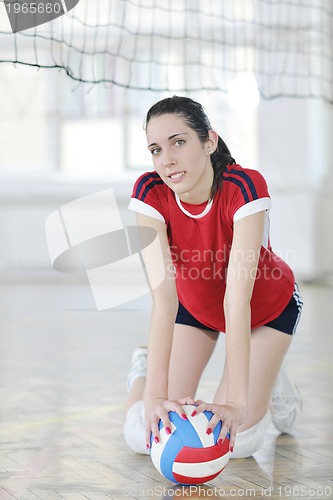 Image of girls playing volleyball indoor game