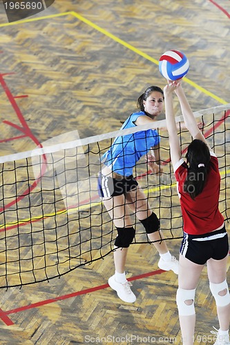 Image of girls playing volleyball indoor game