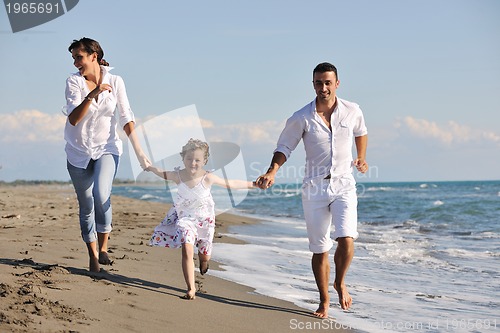 Image of happy young  family have fun on beach