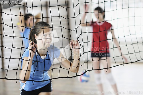 Image of girls playing volleyball indoor game